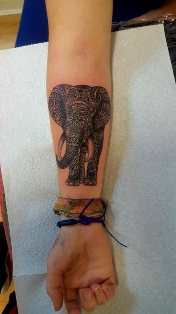 a female wrist elephant tattoo pattern